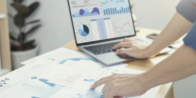 Businesspeople working in finance and accounting Analyze financial graph budget and planning for future in office room.