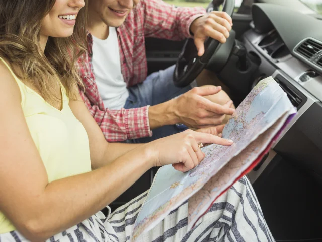 Couple Sitting Car Pointing Finger Location Navigation Map